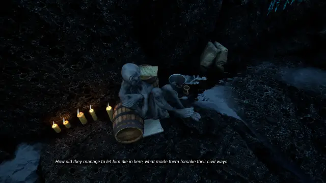 Candles burning beside a dead body in a cave